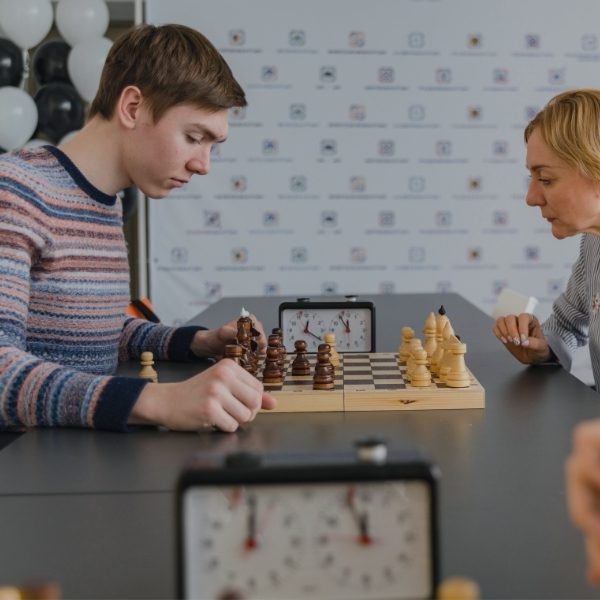 two teens playing chess