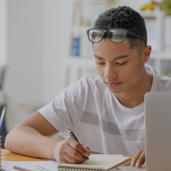 teen boy doing school work